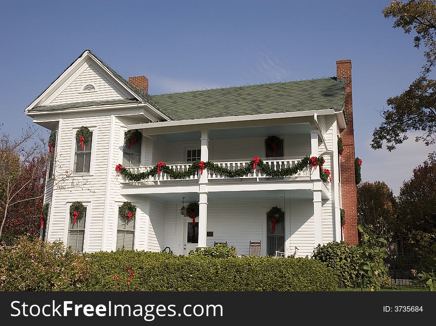 An old colonial farm house decorated for Christmas. An old colonial farm house decorated for Christmas