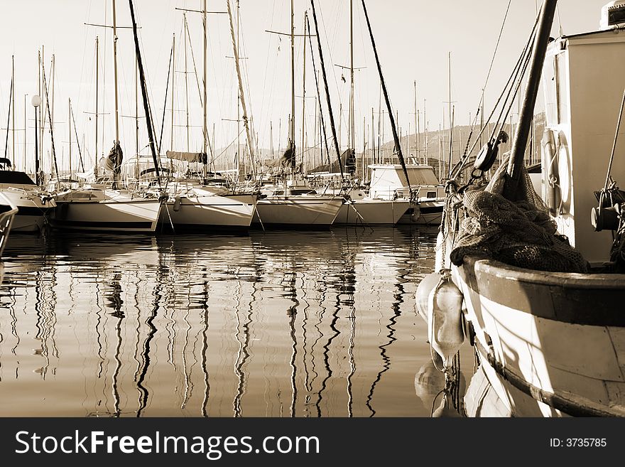 Boat reflections in toulon port, france