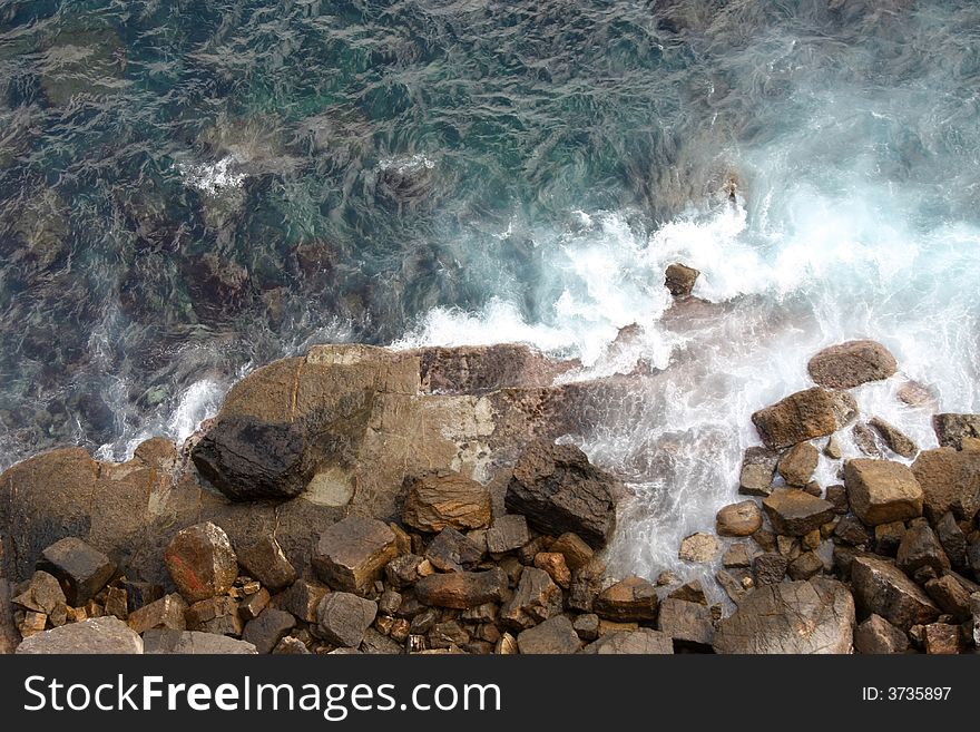 Long exposure of waves crashing against rocks. Long exposure of waves crashing against rocks