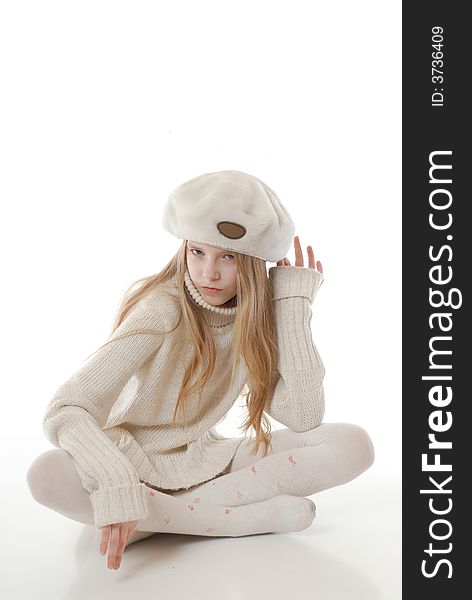 The girl in winter clothes on a white background. The girl in winter clothes on a white background