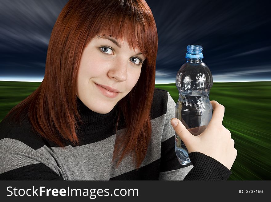 Redhead girl holding water bottle