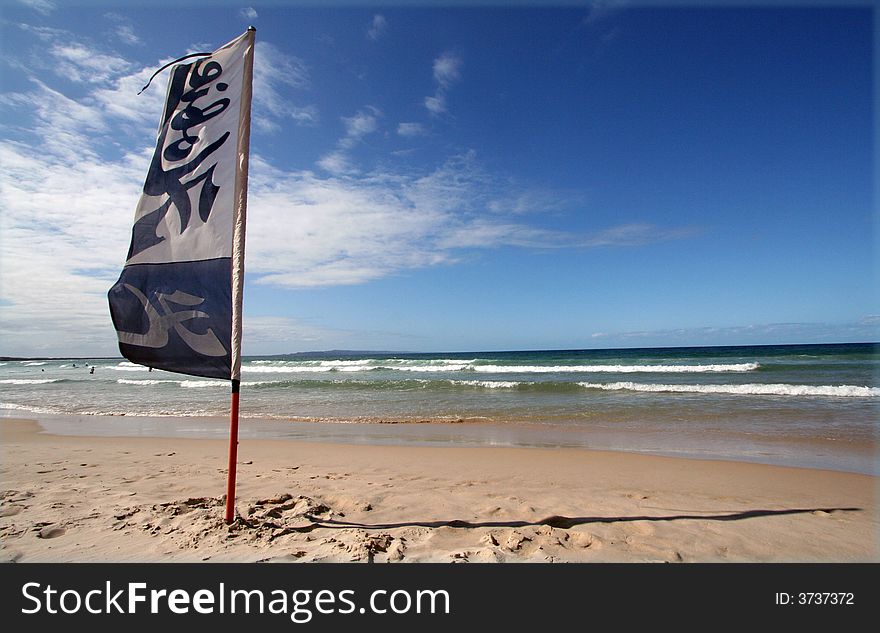 This is a pictire of a flag on an Australian Beach in Noosa, Queensland