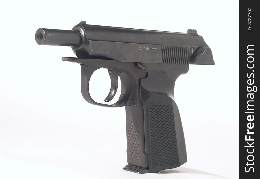 Black pistol at white background