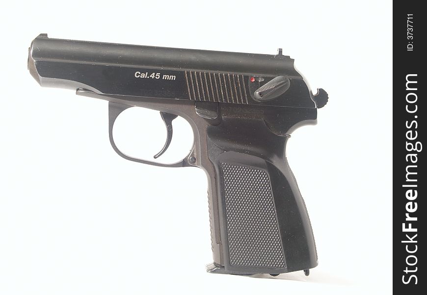 Black pistol at white background