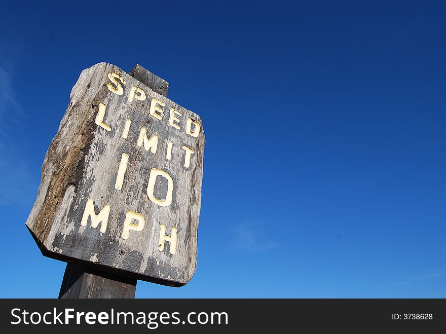 A speed limit sign with a crisp blue background.