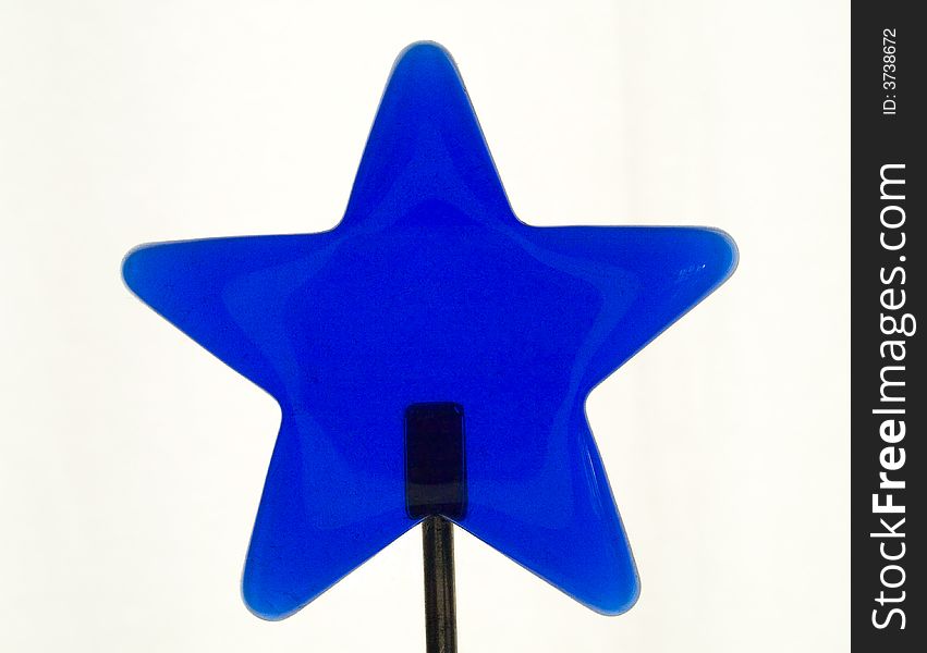 Blue isolatet glass star on a stand. Blue isolatet glass star on a stand