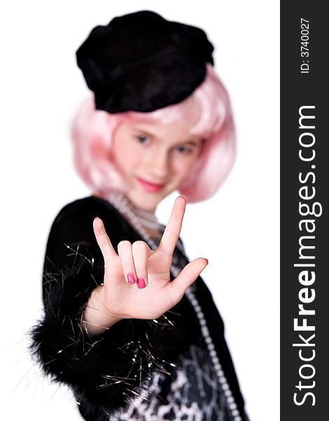 Preteen dressed as a diva in pink hair giving the I love you hand sign.  Shallow DOF with focus on hand. Preteen dressed as a diva in pink hair giving the I love you hand sign.  Shallow DOF with focus on hand.