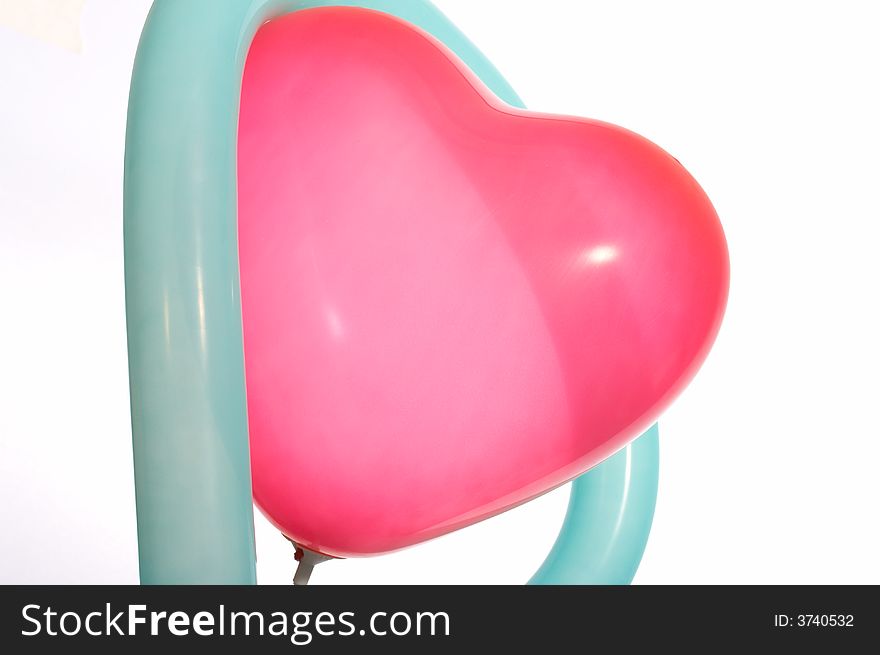 Red heart balloon in the shape of heart