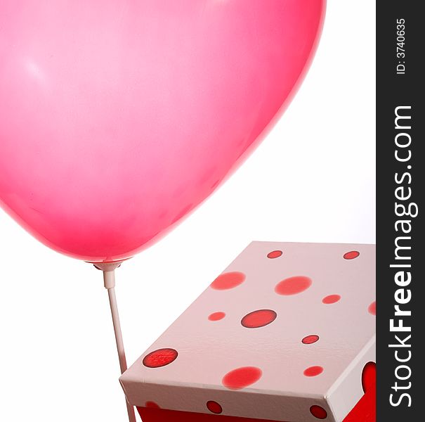 Red balloon and polka dot gift box