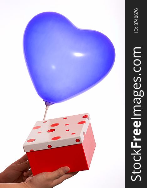hand holding balloon and polkadot  red gift box