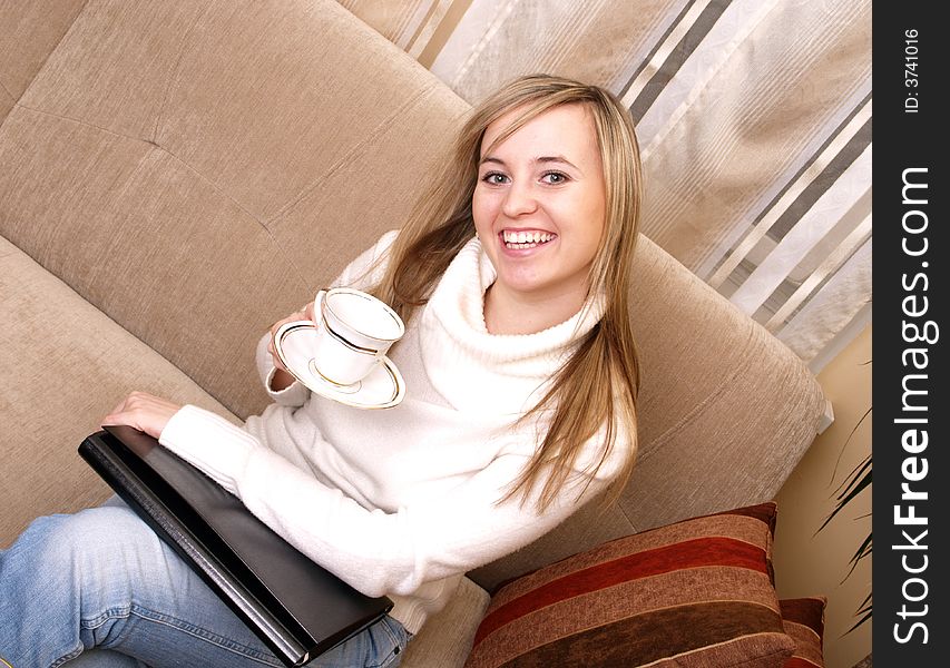 Woman On The Couch With Coffee