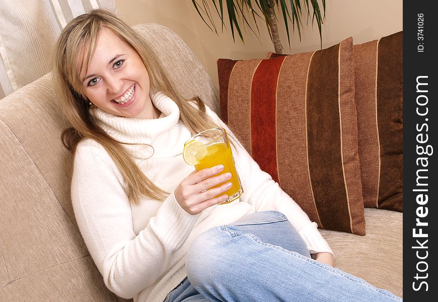 Smiling woman on the couch.