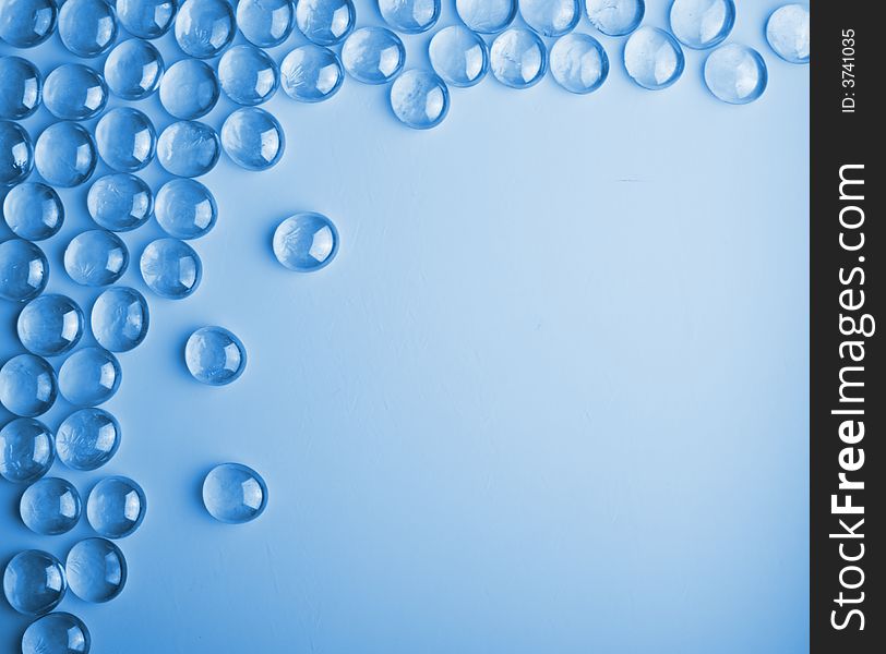 Water drops (glass decoration) on the blue background