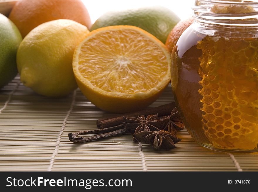 Fresh honey with honeycomb, lemons, oranges, cinnamon, vanilla, anise star. Fresh honey with honeycomb, lemons, oranges, cinnamon, vanilla, anise star