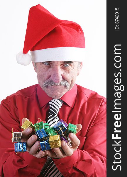 Businessman with Christmas gift and Santa Claus hat. Businessman with Christmas gift and Santa Claus hat.