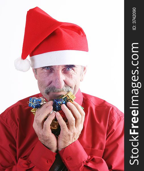 Businessman with Christmas gift and Santa Claus hat. Businessman with Christmas gift and Santa Claus hat.