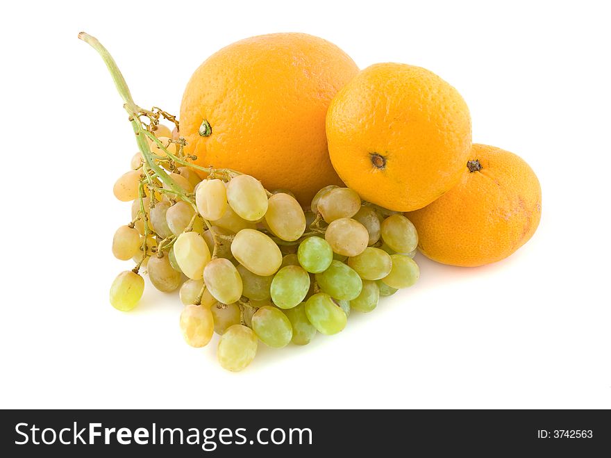 Fresh grapes with orange and tangerines, isolated on white. Fresh grapes with orange and tangerines, isolated on white