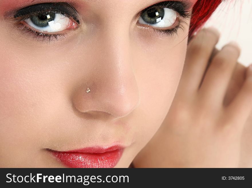 Beautiful young woman with red hair close up. Beautiful young woman with red hair close up.