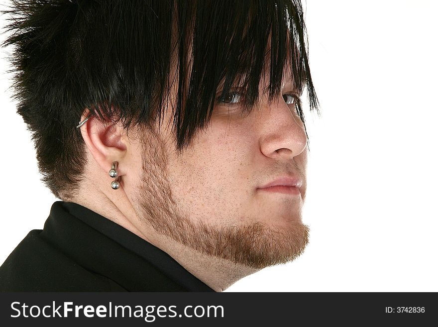 Attractive 24 Year old man over white background with gauge ear ring. Attractive 24 Year old man over white background with gauge ear ring.