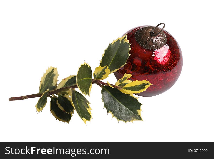 Single red vintage ornament with holly branch. Single red vintage ornament with holly branch