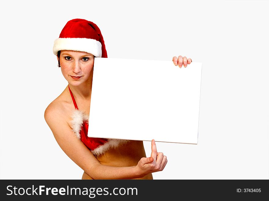 Beautiful girl in christmas bikini and with christmas hat is holding up a white sign for copy space. With background clipping path for your convenience. Beautiful girl in christmas bikini and with christmas hat is holding up a white sign for copy space. With background clipping path for your convenience