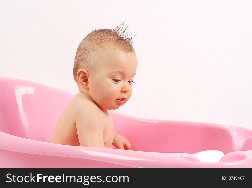 Sweet baby girl in tub on white background. Sweet baby girl in tub on white background