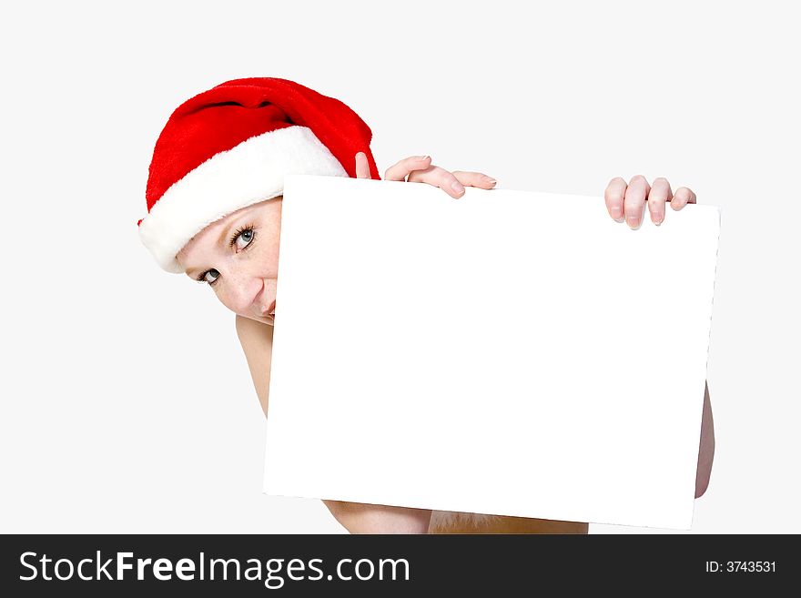Beautiful girl in christmas bikini and with christmas hat is holding up a white sign for copy space. With background clipping path for your convenience. Beautiful girl in christmas bikini and with christmas hat is holding up a white sign for copy space. With background clipping path for your convenience