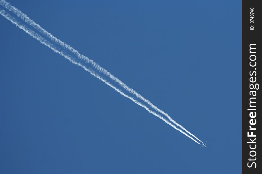 Trail of the commercial airplane on the sky.