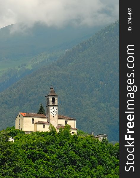 Church on a green hill in the Alps in the north of Italy. Church on a green hill in the Alps in the north of Italy