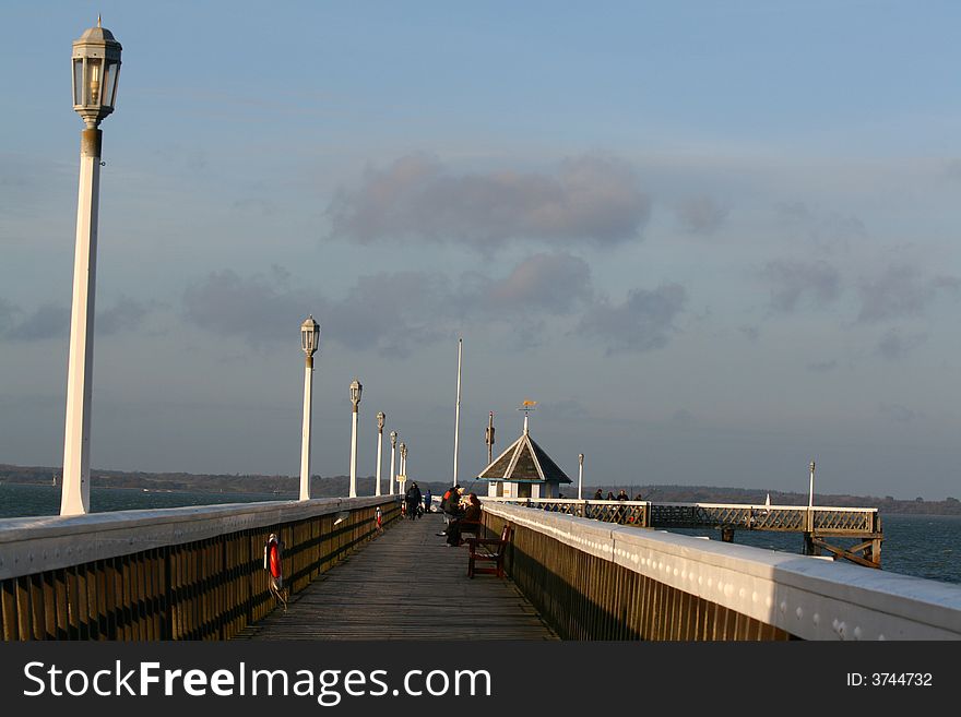 Seaside pier with fishermen