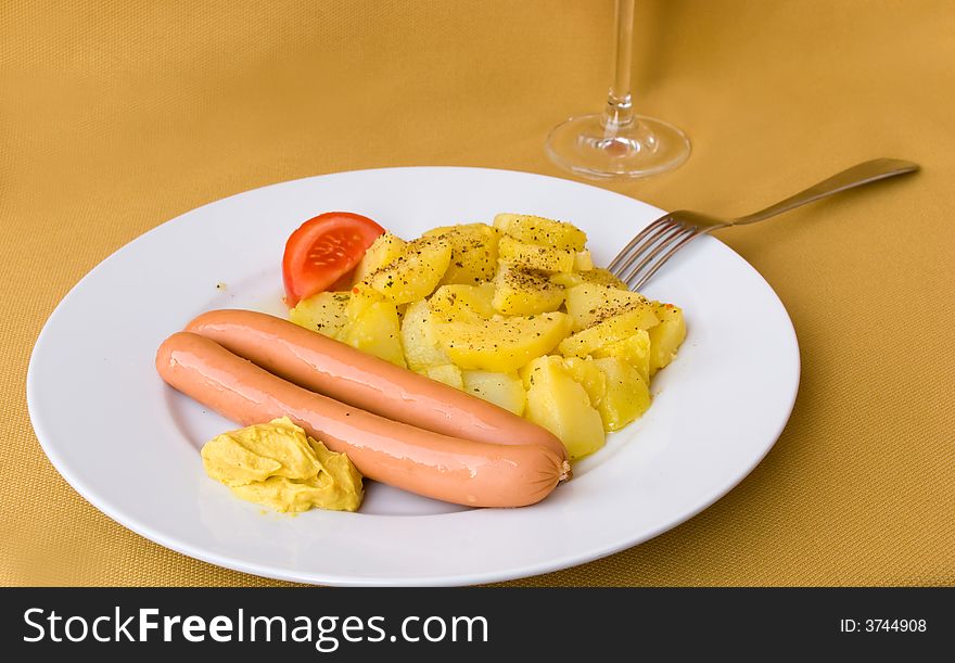 Red sausage with potato ,mustard and wine. Red sausage with potato ,mustard and wine.