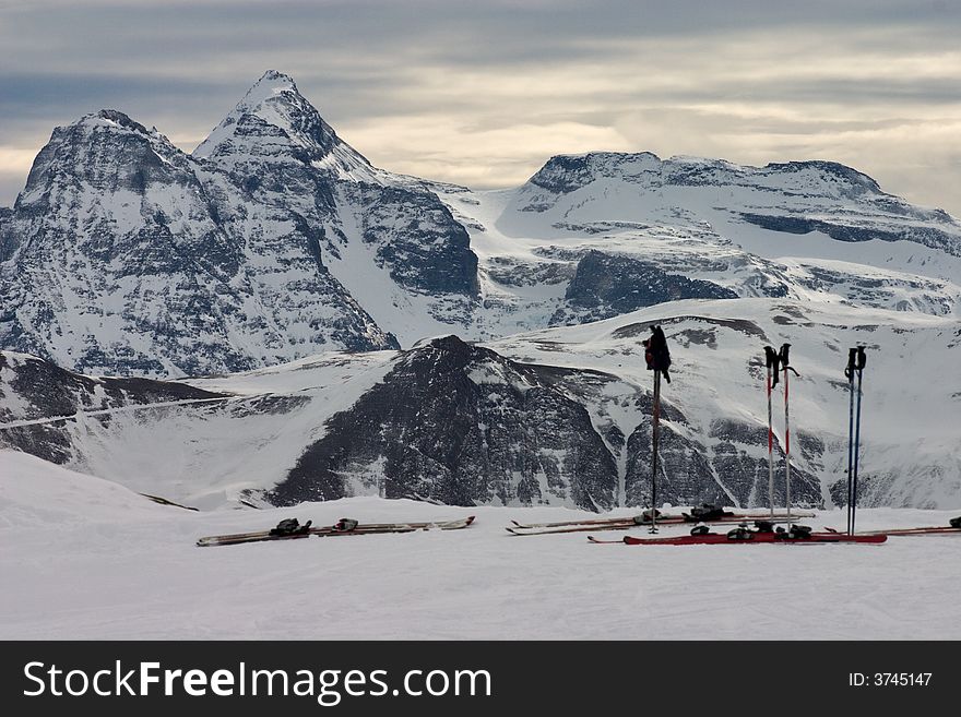 Skying in the Swiss Alps, with Helsenhorn peak in the background. View from Hohfluh, Bettmeralp, Brig Wallis-Valais Switzerland. Skying in the Swiss Alps, with Helsenhorn peak in the background. View from Hohfluh, Bettmeralp, Brig Wallis-Valais Switzerland