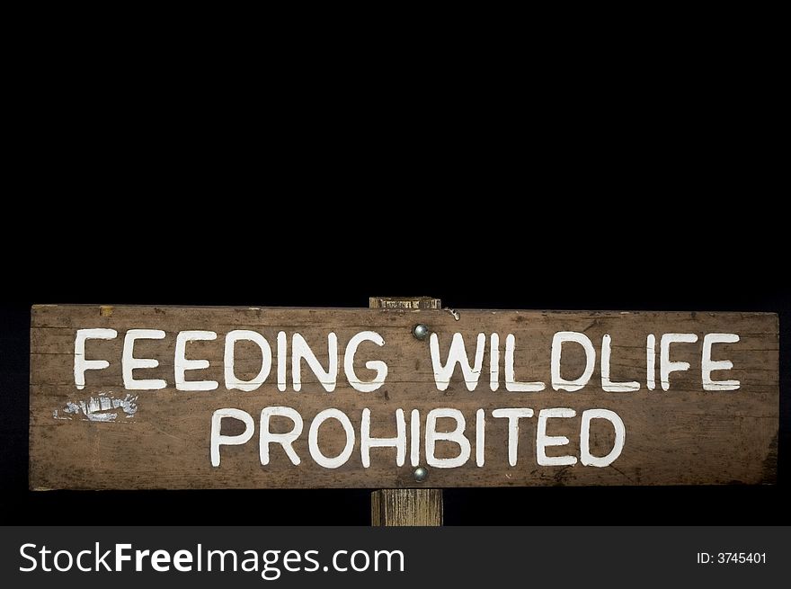 A roadsign instructing people not to feed the wildlife. A roadsign instructing people not to feed the wildlife.