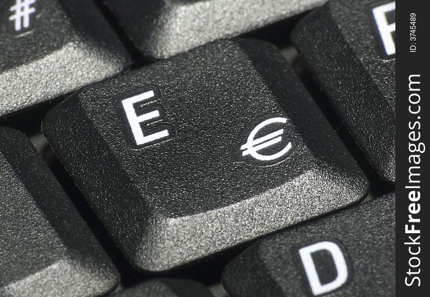 Closeup of the euro key on a keyboard