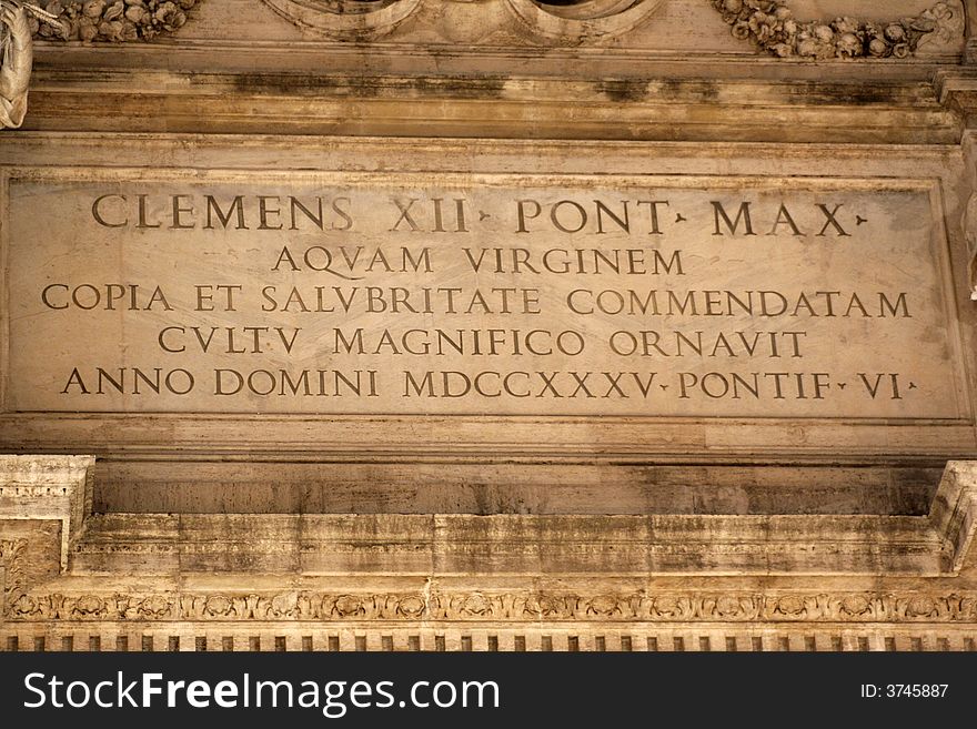 Epitaph in honor of Clement XII, pope of Rome that inaugurated the construction of the famous Trevi fountain (Rome - Italy - Europe). Epitaph in honor of Clement XII, pope of Rome that inaugurated the construction of the famous Trevi fountain (Rome - Italy - Europe)