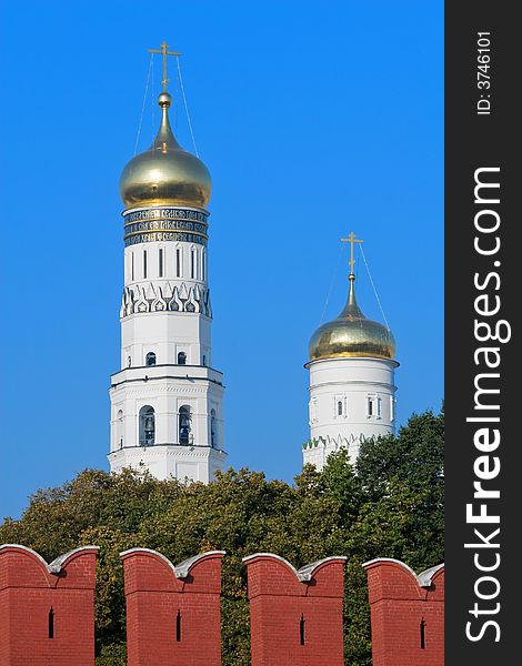 Moscow Kremlin domes under red kremlin wall