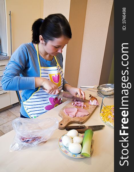 Ham slicing on kitchen desk for layer salad. Ham slicing on kitchen desk for layer salad