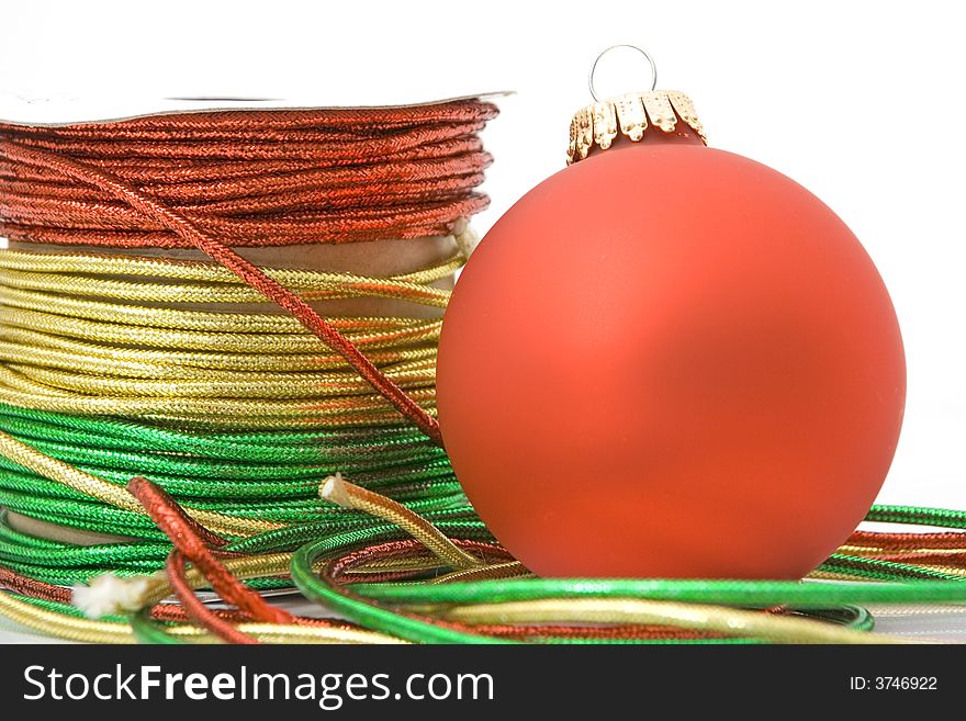 Decorative ropes with red ornament isolated against white background