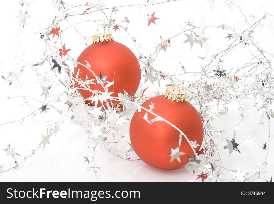 Two red ornaments with stars