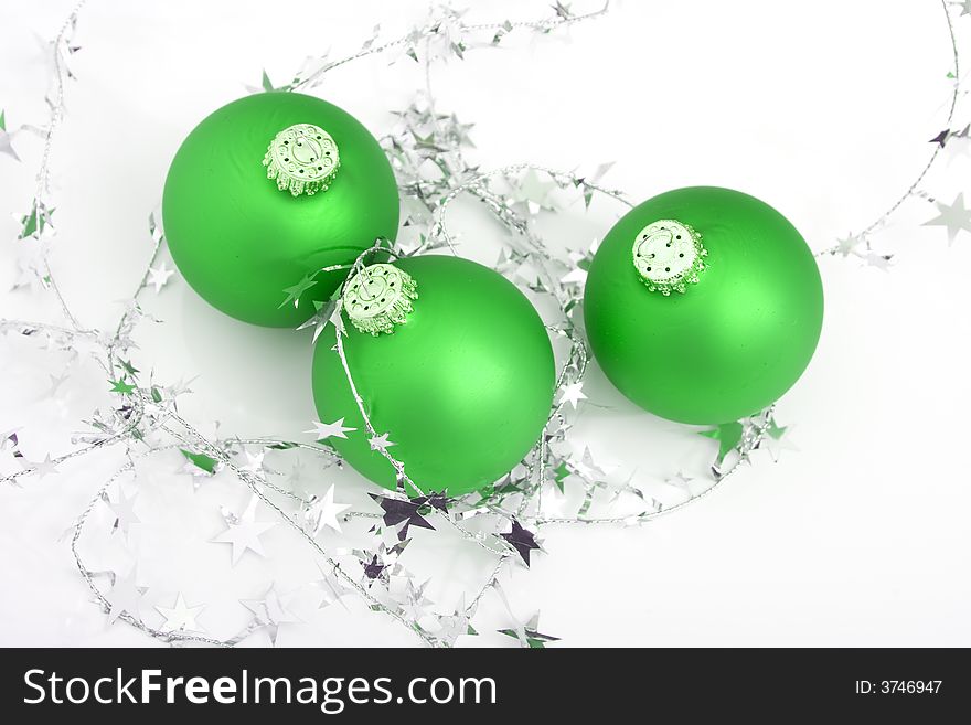 Green ornament with silver stars isolated against white background. Green ornament with silver stars isolated against white background