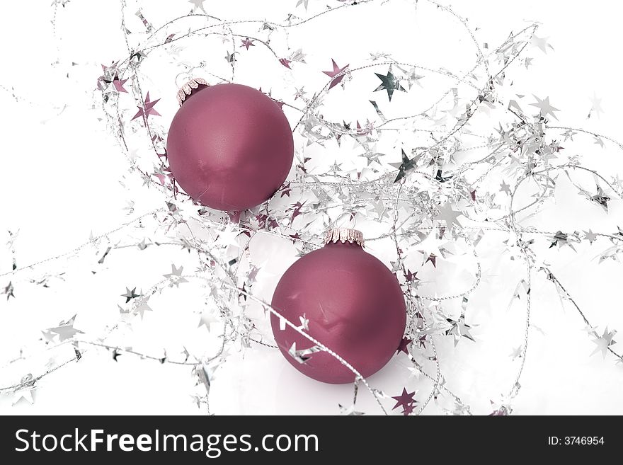 Two red ornaments with stars isolated on a white background