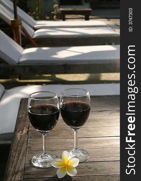 red wine grasses with flowers bench