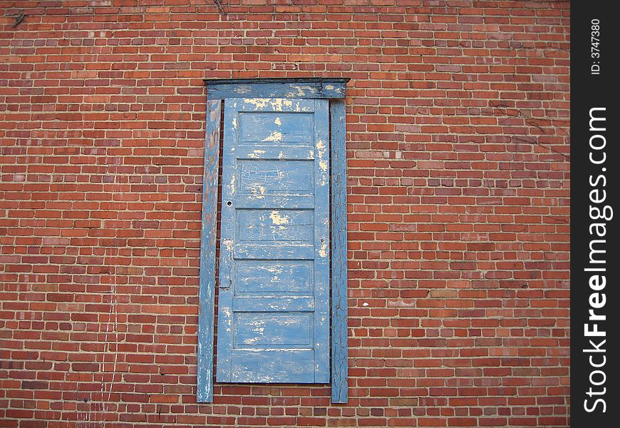 Antiqued blue door to where?