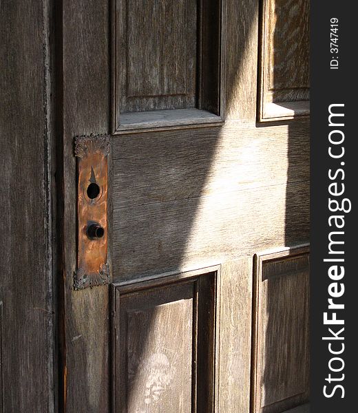 Wooden door w/copper key plate. Wooden door w/copper key plate