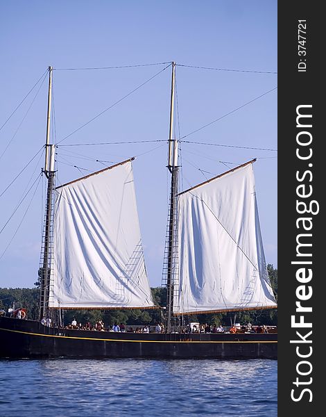 Tall ship with white sail