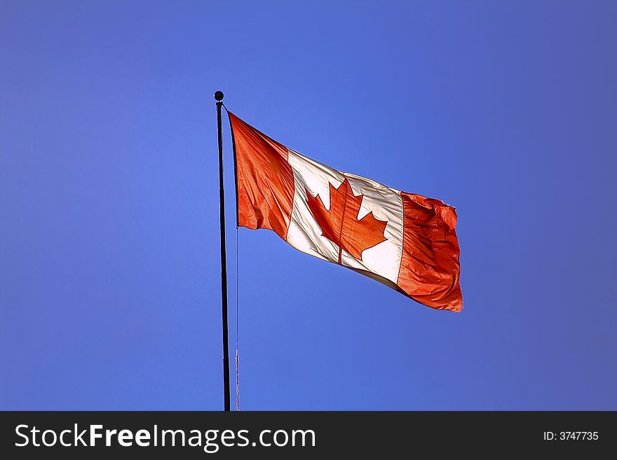 Canadian flag and blue sky