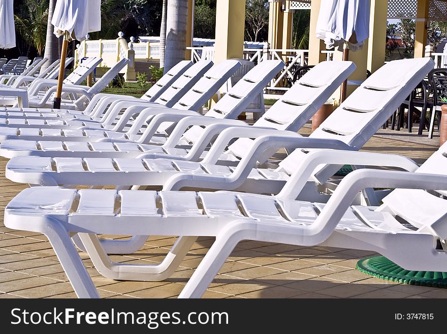 Caribbean holidays pool chairs tropics