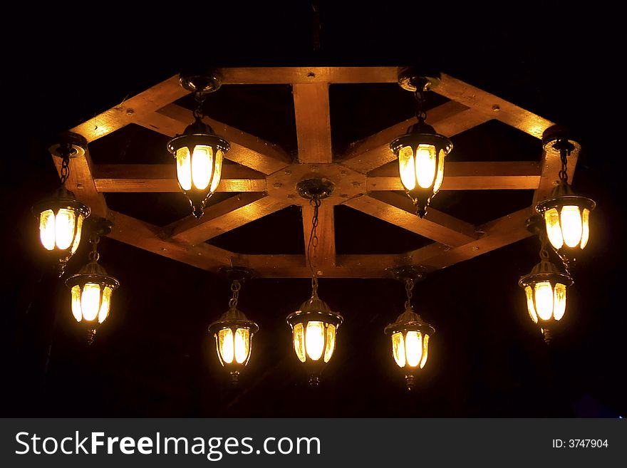 Chandelier on a black background - lights on