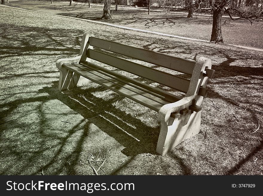 Empty park bench winter scene