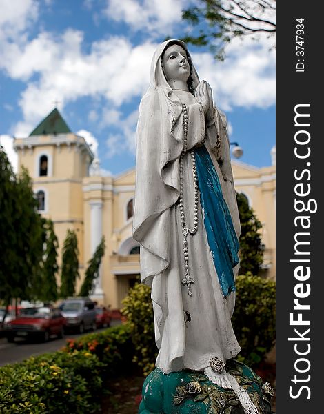 An image of the Virgin Mary outside of a church. An image of the Virgin Mary outside of a church